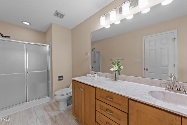 276 Sagamore Dr, Louisburg, NC 27549 - bathroom with vanity, a shower stall, and wood finished floors