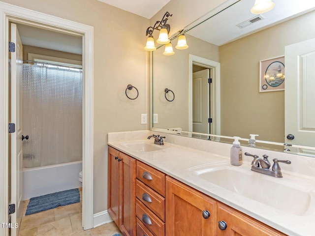 30 Cole Creek Way, Franklinton, NC 27525 - full bathroom featuring double vanity, shower / bath combination with curtain, and tile patterned floors