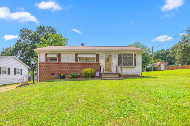 1315 Elder Way, Burlington, NC 27215 - view of front of property featuring brick siding, a chimney, and a storage unit