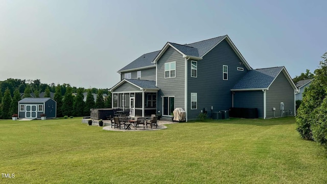 192 Waterpine Dr, Garner, NC 27529 - back of house featuring a patio area, a sunroom, a storage shed, and a lawn