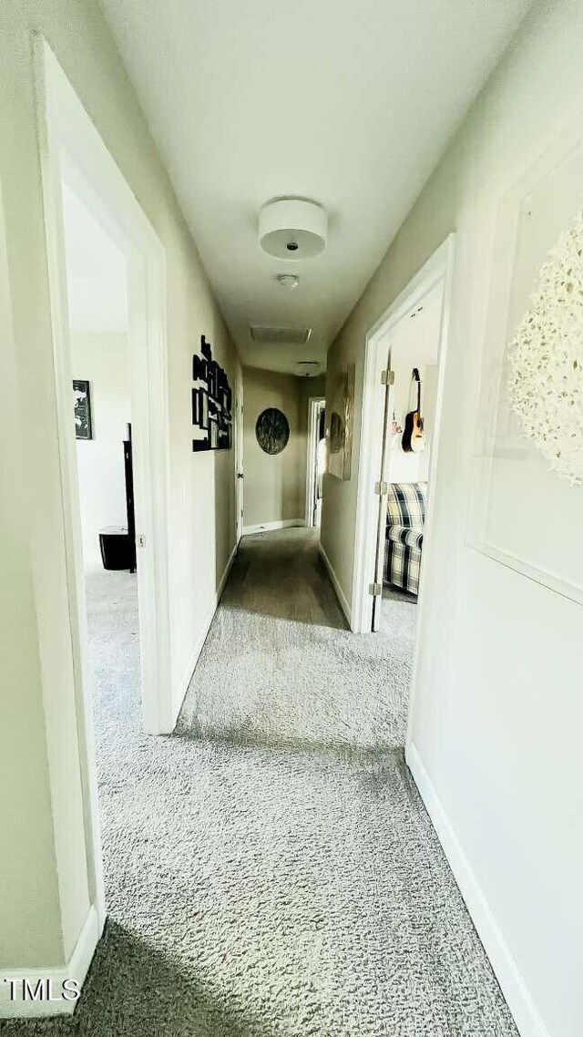 192 Waterpine Dr, Garner, NC 27529 - hallway featuring carpet floors and baseboards