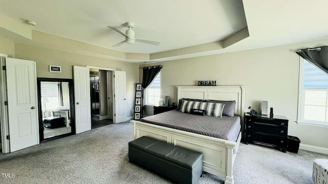 192 Waterpine Dr, Garner, NC 27529 - carpeted bedroom with multiple windows and a ceiling fan