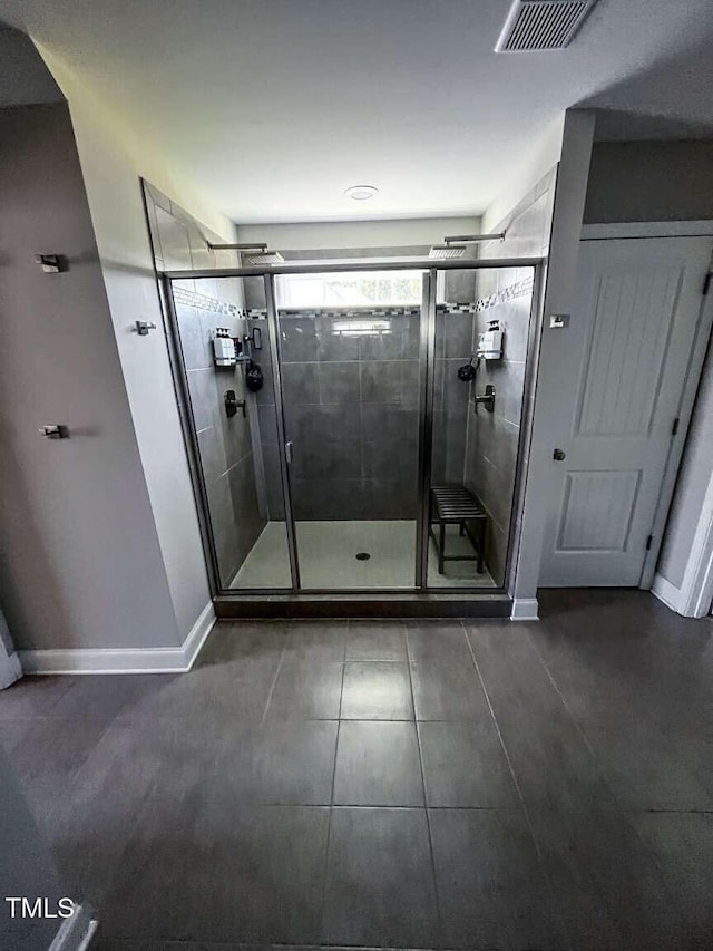 192 Waterpine Dr, Garner, NC 27529 - bathroom featuring a stall shower and tile patterned floors