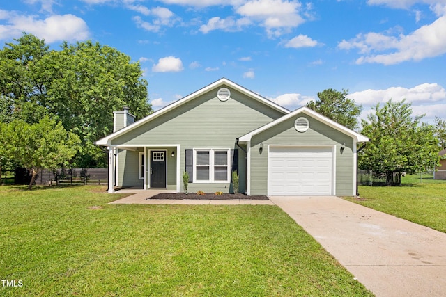 153 Eulon Loop, Raeford, NC 28376 - view of front of home with driveway, a chimney, and a garage