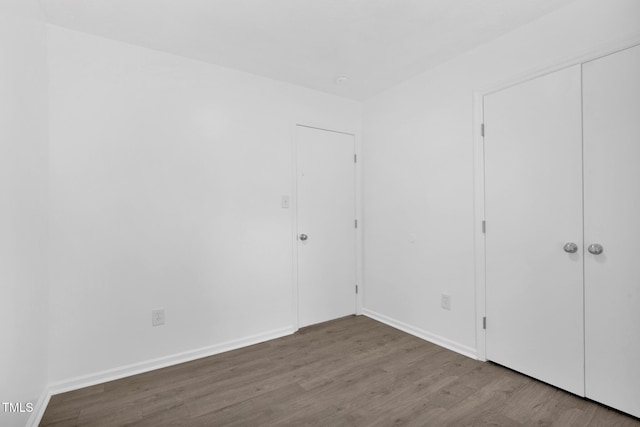 153 Eulon Loop, Raeford, NC 28376 - unfurnished bedroom featuring wood finished floors and a closet