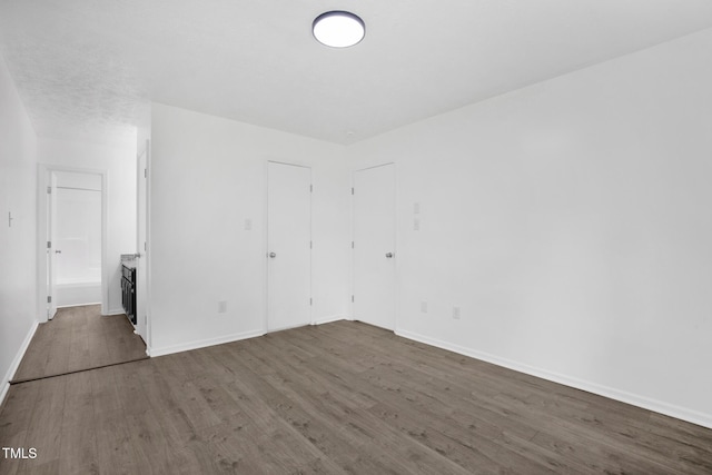 153 Eulon Loop, Raeford, NC 28376 - unfurnished bedroom featuring wood finished floors and baseboards