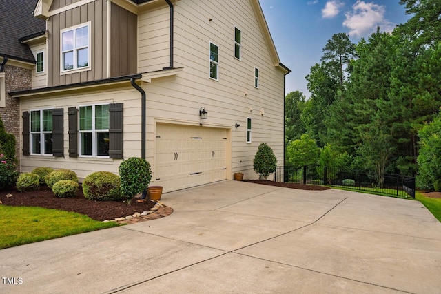 610 Bennett Mtn, Chapel Hill, NC 27516 - view of property exterior featuring board and batten siding, an attached garage, and driveway