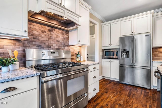 610 Bennett Mtn, Chapel Hill, NC 27516 - kitchen with stainless steel appliances, custom range hood, tasteful backsplash, light stone counters, and white cabinetry