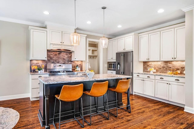610 Bennett Mtn, Chapel Hill, NC 27516 - kitchen featuring stainless steel appliances, dark wood-style flooring, tasteful backsplash, an island with sink, and decorative light fixtures