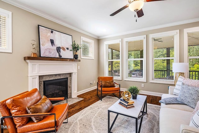 610 Bennett Mtn, Chapel Hill, NC 27516 - living room with crown molding, a ceiling fan, a tile fireplace, and wood finished floors