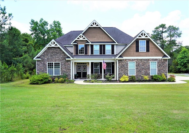 930 Old Vander Rd, Fayetteville, NC 28312 - craftsman-style home with stone siding, a front lawn, and a porch