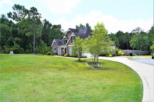 930 Old Vander Rd, Fayetteville, NC 28312 - craftsman house featuring a front lawn, curved driveway, and stone siding