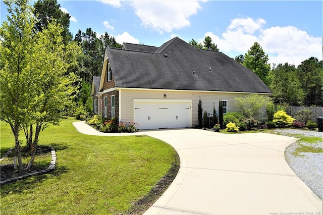930 Old Vander Rd, Fayetteville, NC 28312 - view of side of property featuring concrete driveway, an attached garage, and a shingled roof