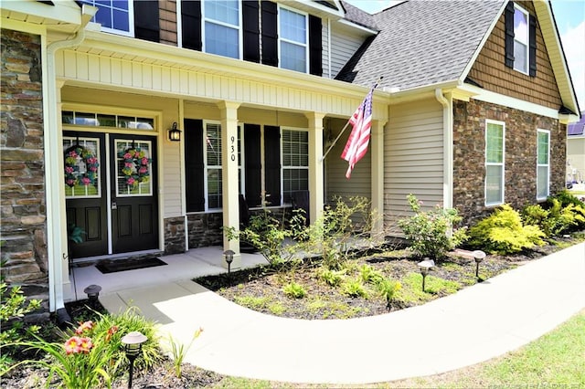 930 Old Vander Rd, Fayetteville, NC 28312 - doorway to property featuring stone siding, roof with shingles, and a porch