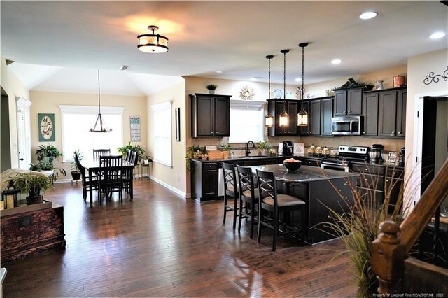 930 Old Vander Rd, Fayetteville, NC 28312 - kitchen with stainless steel appliances, a breakfast bar area, a kitchen island, pendant lighting, and recessed lighting