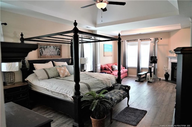 930 Old Vander Rd, Fayetteville, NC 28312 - bedroom featuring wood finished floors, a fireplace with flush hearth, and ceiling fan