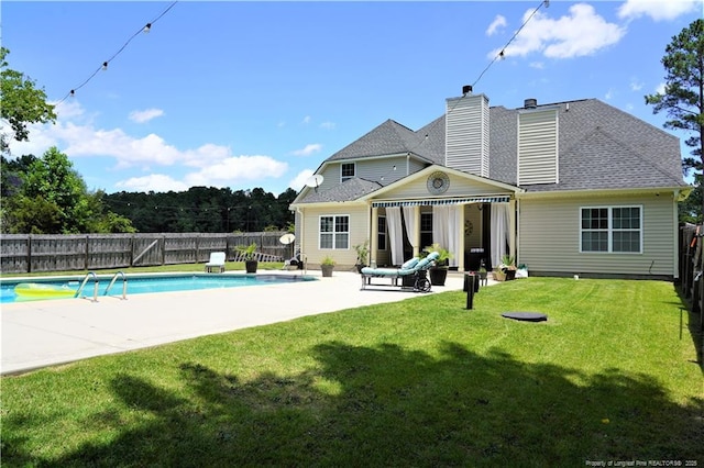 930 Old Vander Rd, Fayetteville, NC 28312 - rear view of house with a patio area, a fenced backyard, and a chimney