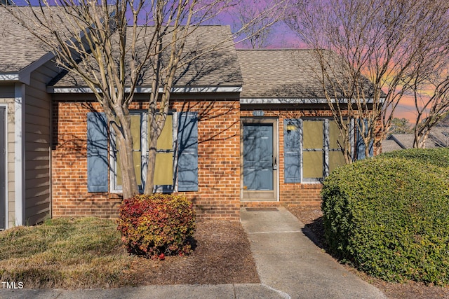 61 Fashion Pl, Durham, NC 27705 - view of front of house with brick siding and roof with shingles