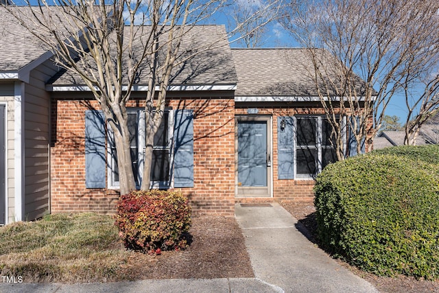 61 Fashion Pl, Durham, NC 27705 - view of front facade featuring brick siding and a shingled roof