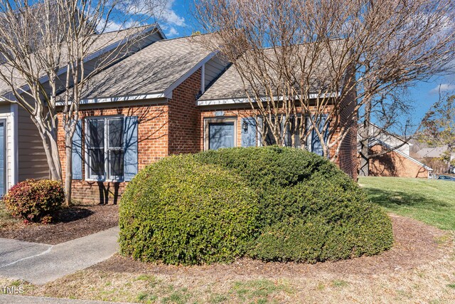 61 Fashion Pl, Durham, NC 27705 - view of front of home featuring a shingled roof and brick siding