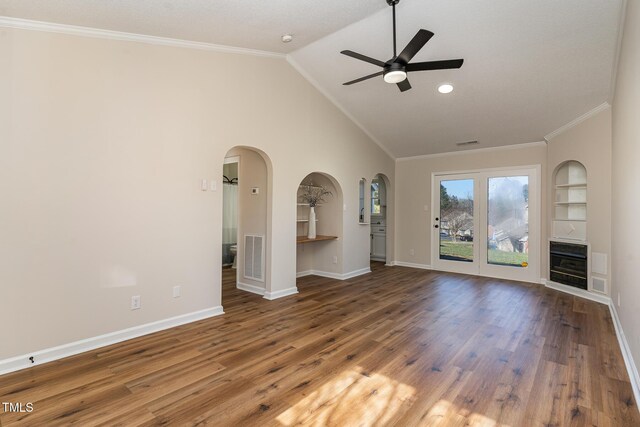 61 Fashion Pl, Durham, NC 27705 - unfurnished living room featuring heating unit, ceiling fan, wood finished floors, arched walkways, and crown molding