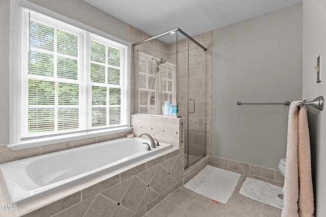 10721 Marabou Ct, Raleigh, NC 27614 - full bath with a bath, plenty of natural light, a stall shower, and tile patterned floors