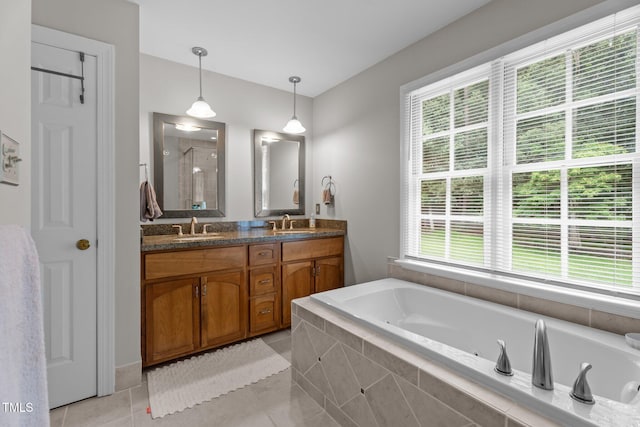 10721 Marabou Ct, Raleigh, NC 27614 - full bath featuring a shower stall, healthy amount of natural light, a whirlpool tub, and double vanity