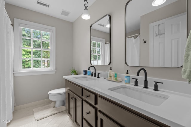 10721 Marabou Ct, Raleigh, NC 27614 - full bath featuring double vanity and tile patterned flooring