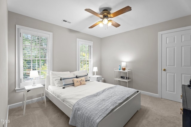 10721 Marabou Ct, Raleigh, NC 27614 - bedroom with light colored carpet and a ceiling fan