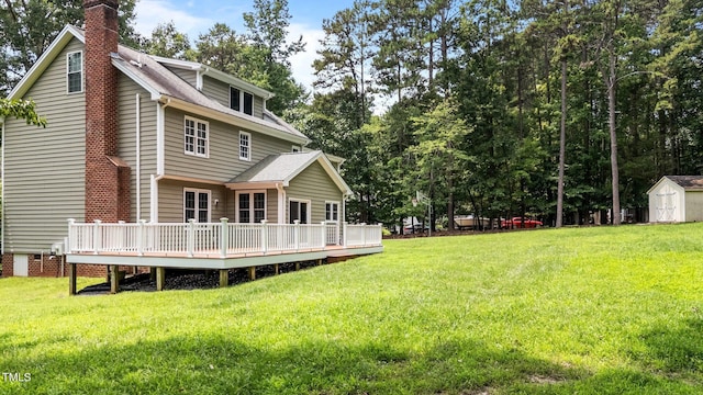 10721 Marabou Ct, Raleigh, NC 27614 - rear view of property with a shed, a chimney, a deck, and a lawn
