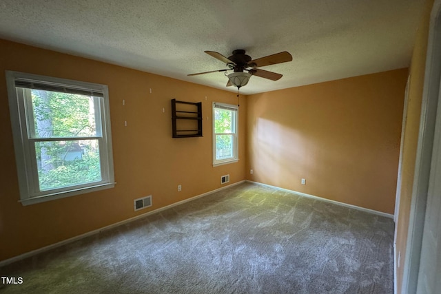 609 Sloan Dr, Cary, NC 27511 - carpeted spare room with ceiling fan and a textured ceiling