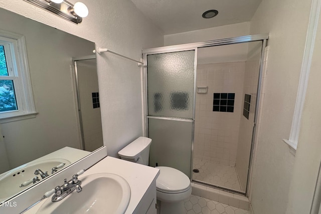 609 Sloan Dr, Cary, NC 27511 - bathroom with vanity, a shower stall, and tile patterned flooring