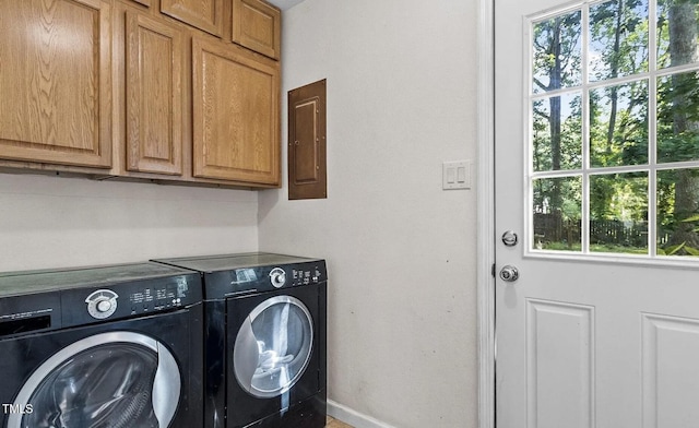 609 Sloan Dr, Cary, NC 27511 - washroom with cabinet space, washing machine and dryer, and electric panel