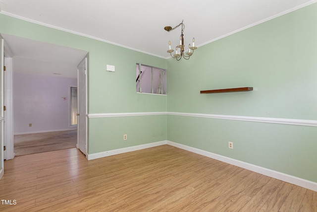 4305 Lake Ridge Dr, Raleigh, NC 27604 - empty room featuring wood finished floors, crown molding, and a chandelier