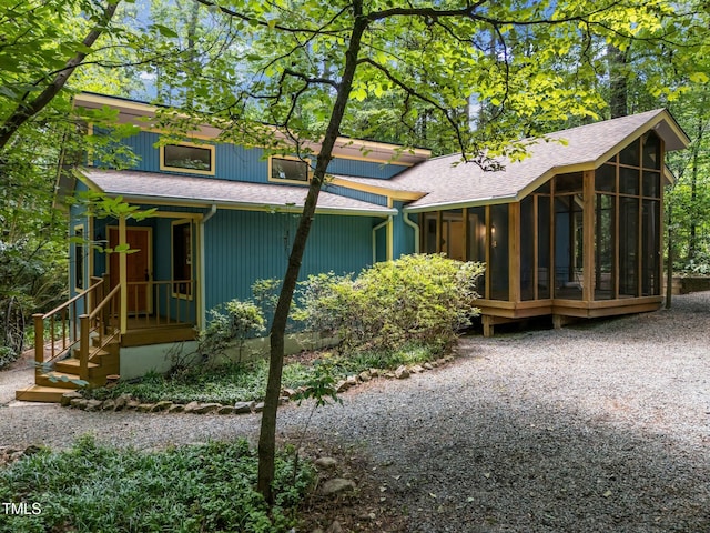 9709 Greenfield Rd, Chapel Hill, NC 27516 - back of house with a sunroom and a shingled roof