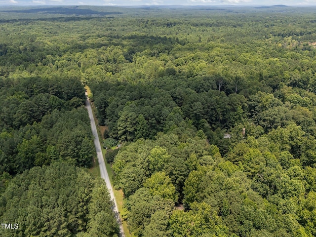 9709 Greenfield Rd, Chapel Hill, NC 27516 - aerial overview of property's location featuring a forest and property parcel outlined