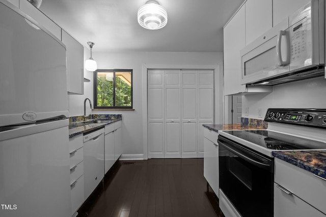 9709 Greenfield Rd, Chapel Hill, NC 27516 - kitchen featuring white appliances, white cabinets, dark wood-style floors, dark stone countertops, and decorative light fixtures
