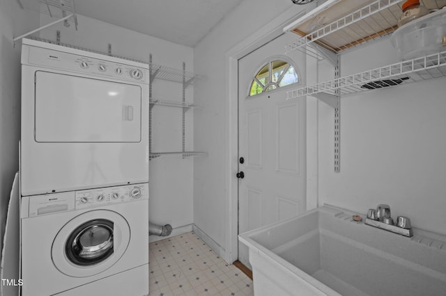 9709 Greenfield Rd, Chapel Hill, NC 27516 - laundry room with stacked washer / drying machine and light floors