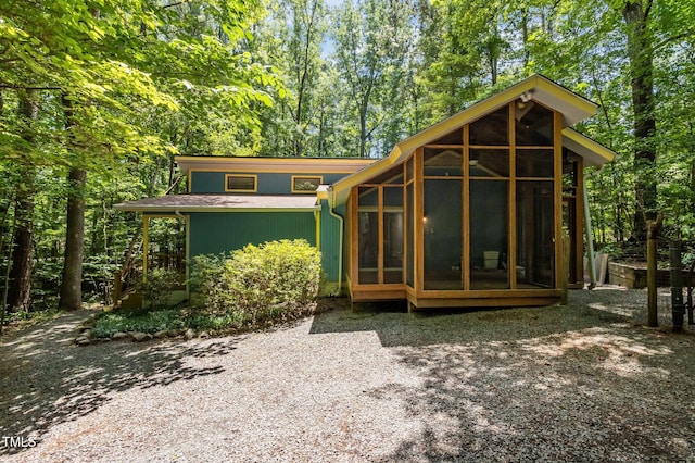 9709 Greenfield Rd, Chapel Hill, NC 27516 - back of house with a sunroom
