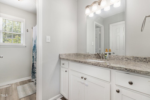 11 Sherman Rd, Fuquay Varina, NC 27526 - full bathroom featuring vanity, wood finished floors, and curtained shower