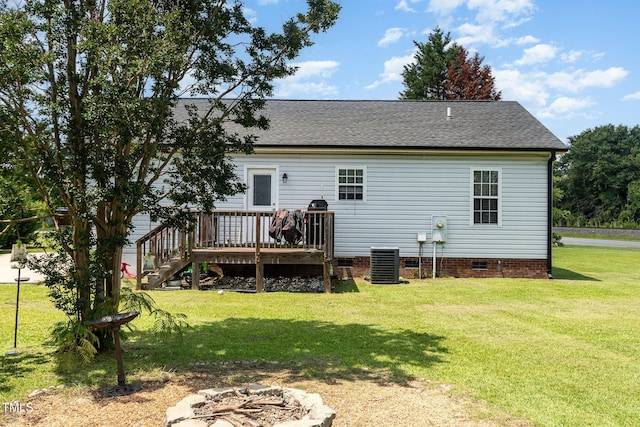 11 Sherman Rd, Fuquay Varina, NC 27526 - rear view of house featuring crawl space, a wooden deck, a shingled roof, an outdoor fire pit, and a yard
