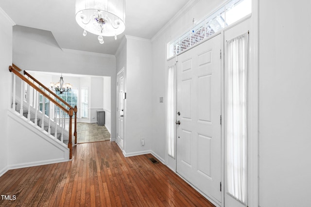 5125 Pinehall Wynd, Raleigh, NC 27604 - entryway with a chandelier, wood-type flooring, stairway, and ornamental molding