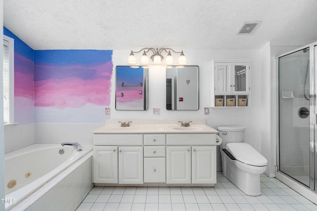 5125 Pinehall Wynd, Raleigh, NC 27604 - full bathroom featuring a textured ceiling, double vanity, a whirlpool tub, a shower stall, and tile patterned flooring