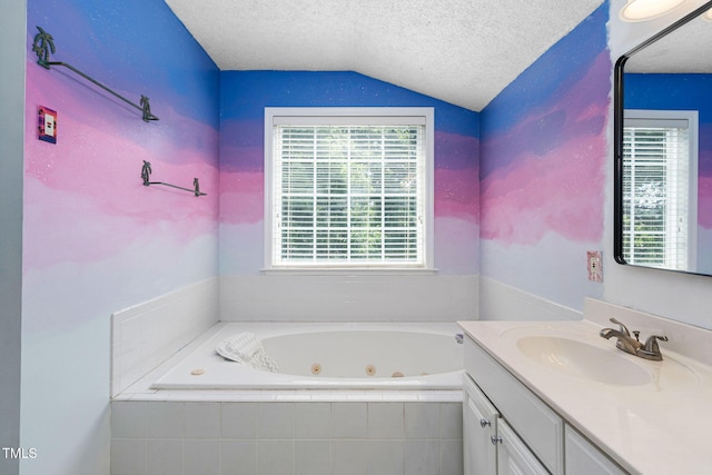 5125 Pinehall Wynd, Raleigh, NC 27604 - full bath featuring vaulted ceiling, a tub with jets, vanity, and a textured ceiling