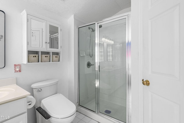 5125 Pinehall Wynd, Raleigh, NC 27604 - full bath featuring a shower stall, vanity, a textured ceiling, and tile patterned floors