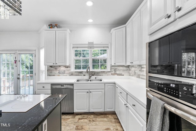 5125 Pinehall Wynd, Raleigh, NC 27604 - kitchen featuring dishwasher, built in microwave, recessed lighting, backsplash, and white cabinets