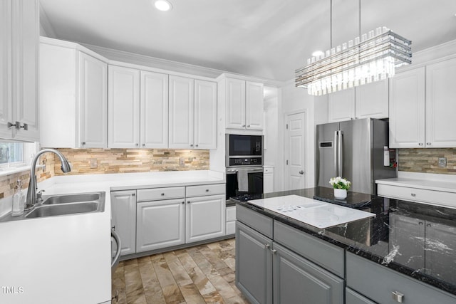 5125 Pinehall Wynd, Raleigh, NC 27604 - kitchen with appliances with stainless steel finishes, white cabinetry, backsplash, gray cabinets, and decorative light fixtures