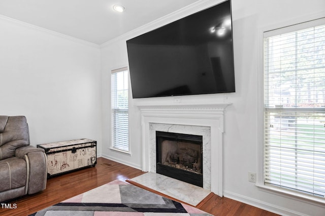 5125 Pinehall Wynd, Raleigh, NC 27604 - living room featuring wood finished floors, ornamental molding, and a fireplace