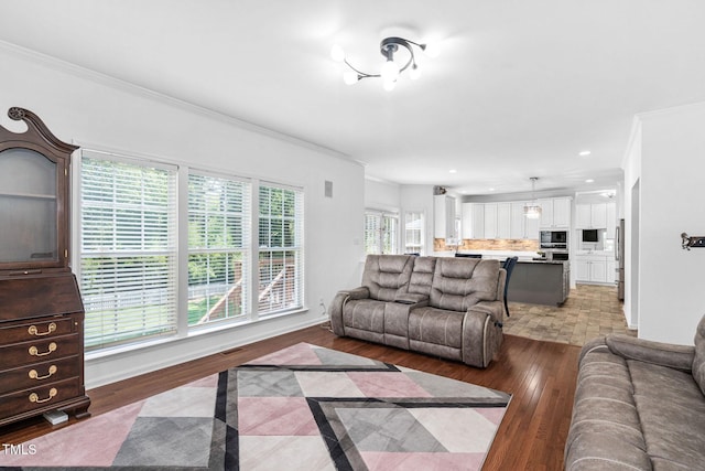 5125 Pinehall Wynd, Raleigh, NC 27604 - living room with crown molding, wood finished floors, and recessed lighting