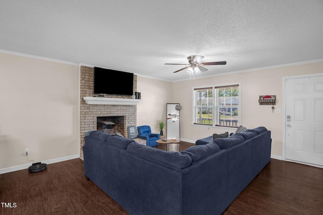 117 James Dr, Pine Level, NC 27568 - living room featuring wood finished floors, ceiling fan, a fireplace, a textured ceiling, and ornamental molding